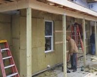 Image of mineral wool as board sheathing for building under construction